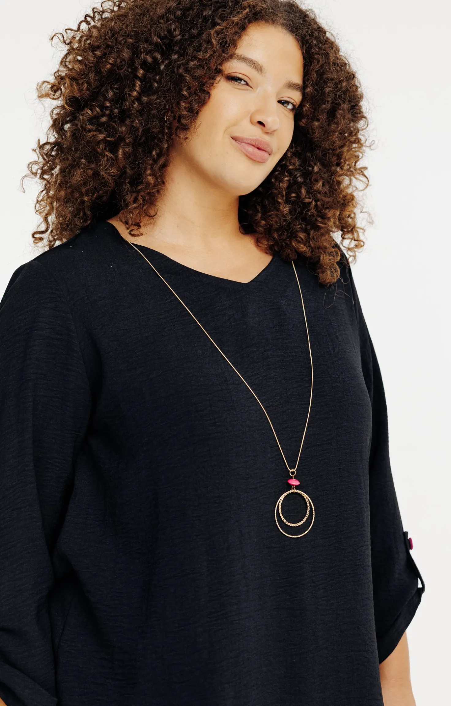 Tunique unie avec boutons colorés